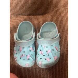 Crocs with a narwhal pattern